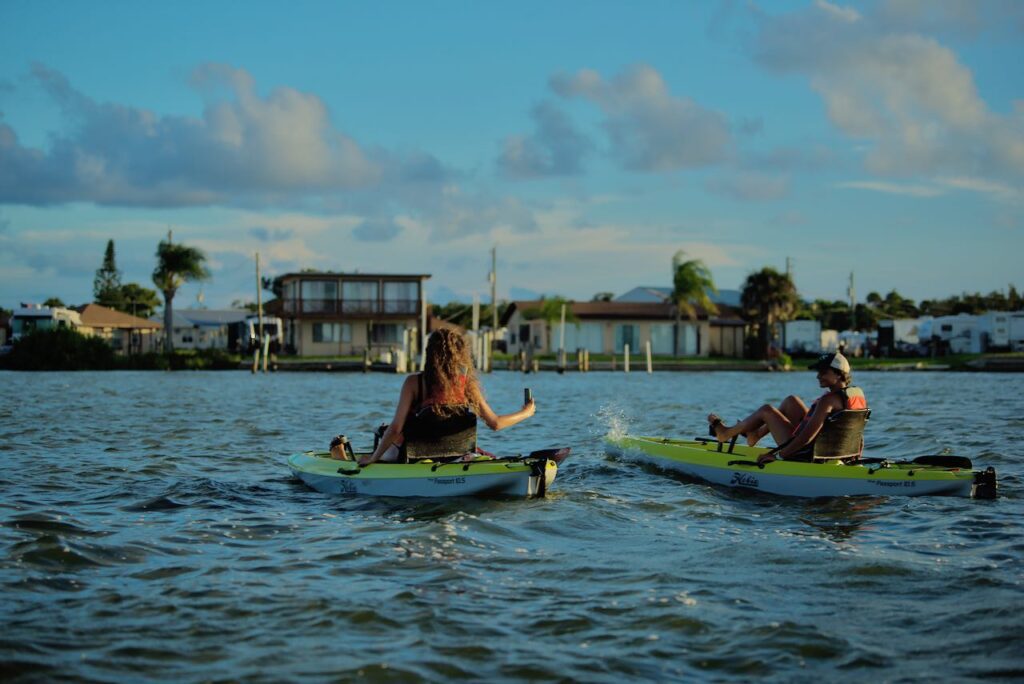 Sunset Guided kayak Tour with Women kayaking & taking pictures with Viking EcoTours