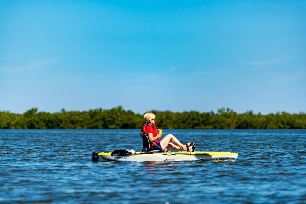 Woman uses pedal kayak on guided Sunrise and Morning Tour through Canaveral National Seashore with Viking EcoTours