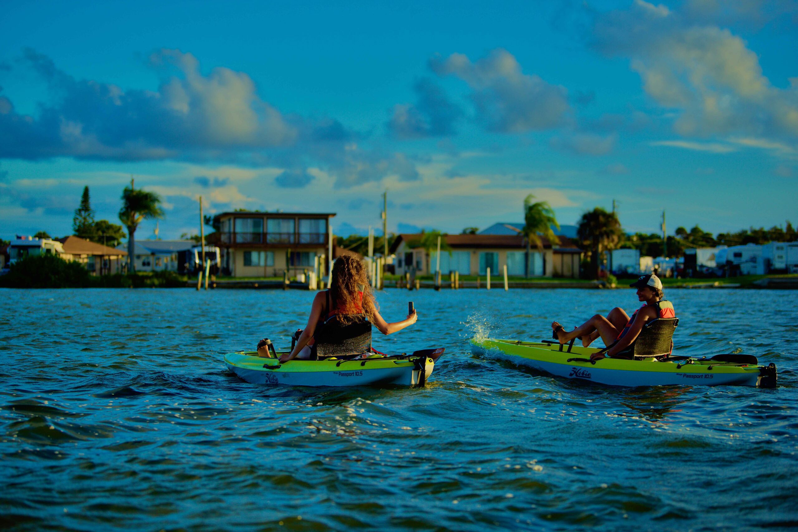 Sunset Guided kayak Tour with Women kayaking & taking pictures with Viking EcoTours