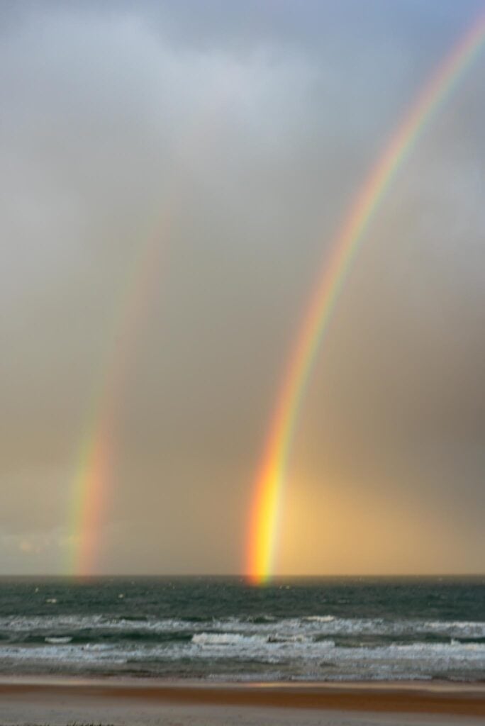 Double Rainbow over the Atlantic ocean and beach.